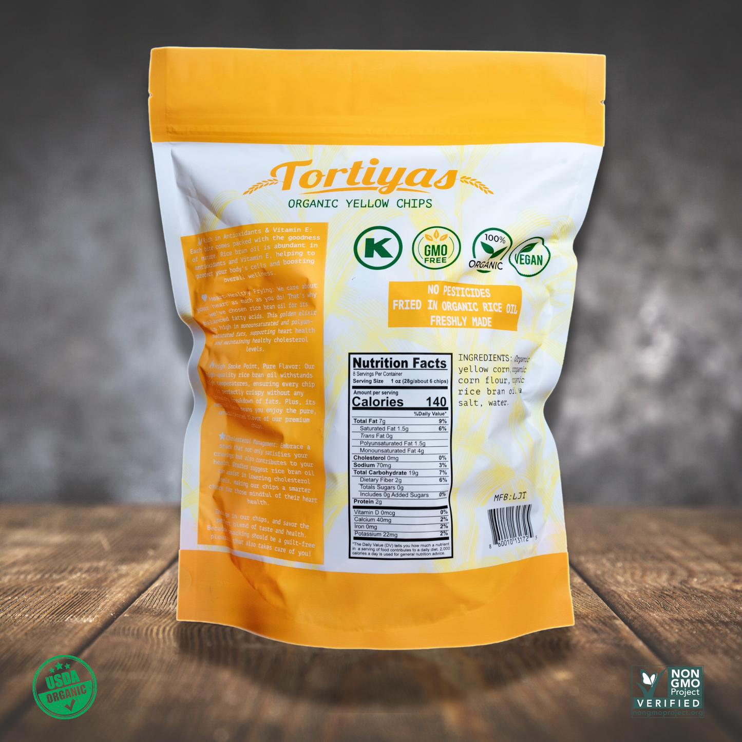 back Product image of Tortiyas 6 ounce organic yellow tortilla chips bag on top of a wooden table